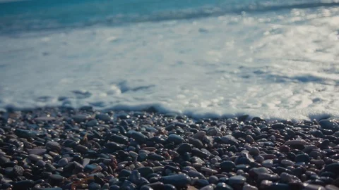 Summertime. Close-up beautiful ocean fluffy white waves crashing on the beach Stock Footage 124931870