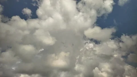 Summertime clouds on a windy day against a blue sky Stock Footage 274556181
