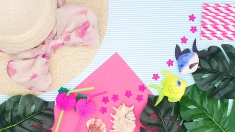Summertime concept. Summer vacation accessories appear - Stop motion Stock Footage 128583130