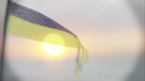 Summertime, yellow and blue flag, flying at the beach, 4k render Stock Footage 226342156