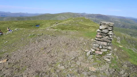 The summit cairn of Red Screes fell, Kirkstone pass, Lake District Stock Footage 137021146