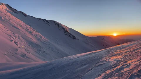 Summit push day beginning with incredible sunrise during Extreme expedition unde Stockbeeldmateriaal 333885858