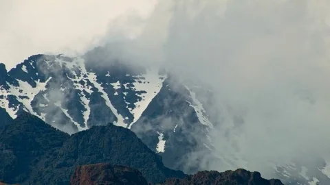 Summit snowy rocky cliffs and fog clouds Alvord Desert Steens Mountain Near Stock-Footage 81894078