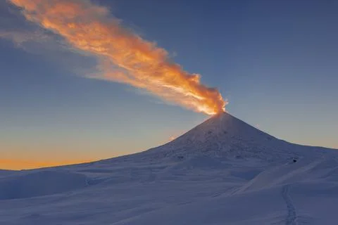 At summit of volcano's explosive eruption, ash column rose up to many km up.. Stock Photos