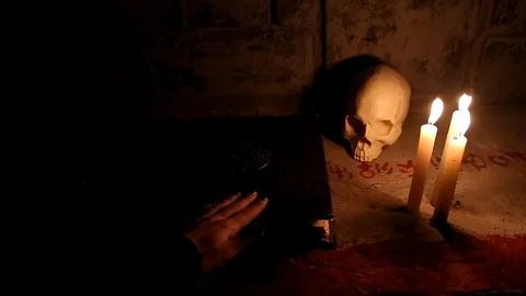 The summoner flips through the demonic book Stock-Footage 88713432