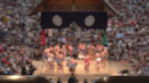 Sumo wrestlers stand on the flatform for the opening ceremony before matches Stock Footage 100792741
