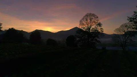 Sun is about to rise behind the mountain. Sunrise sunset Aerial Drone Shot. 库存影片 158284724