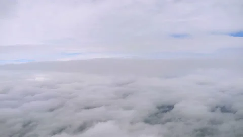 Sun above the clouds during flight in 4k Stock Footage 157004701