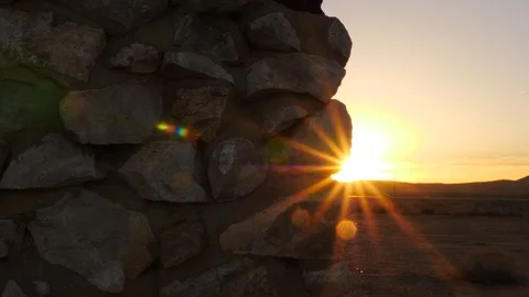 Sun against old stone and motor building.  Stock Footage 100537538