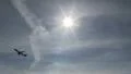 Sun with airplane passing HD Footage