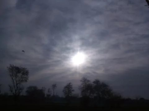 This is sun and black clouds on the sky Stock Photos