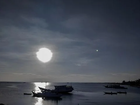 Sun and boat Stock Photos