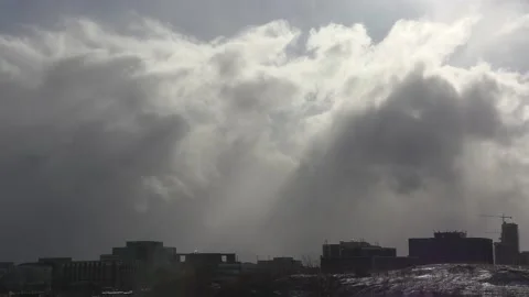 Sun and cloud mix as storm approaches city from the west 動画素材 149544967