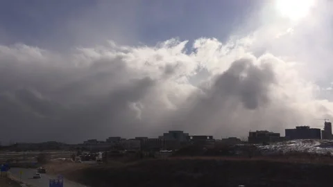 Sun and cloud mix as storm approaches city from the west Stock Footage 149595495