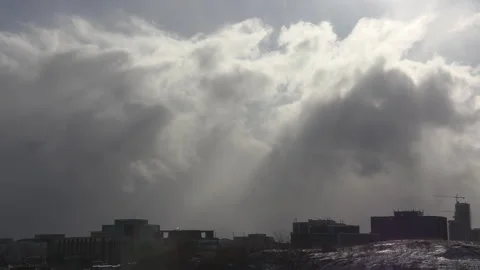 Sun and cloud mix as storm approaches city from the west 動画素材 149595936