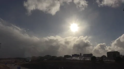 Sun and cloud mix as storm approaches city from the west 動画素材 149596560