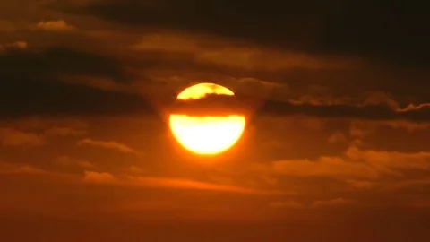 The sun and clouds after a cyclone. Evening, sunset. Crimson shade. 動画素材 70424575