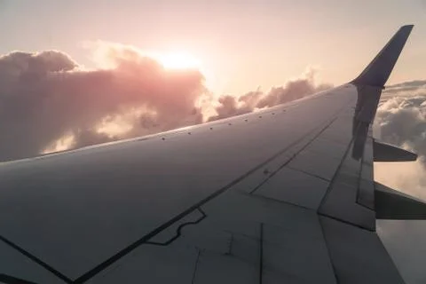 Sun and Clouds and sky as seen through window of an aircraft Foto stock