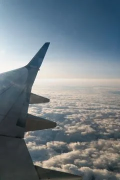 Sun and Clouds and sky as seen through window of an aircraft Stock Photos