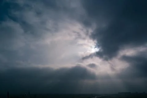 Sun and clouds on a blue sky Stock Photos