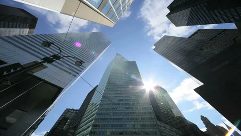 The Sun and Clouds Moving Above the Skyscrapers Video stock 327312293