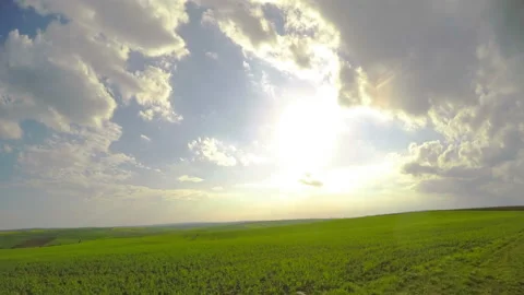 Sun and Clouds over Fields. Timelapse UHD Видео 106463337