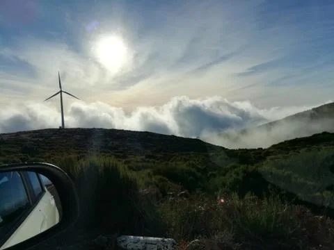 Sun and clouds over the mountains Stock Photos