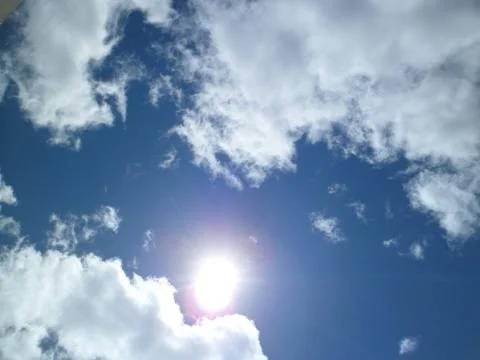 Sun and clouds Stock Photos