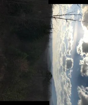 Sun and clouds Stock Photos