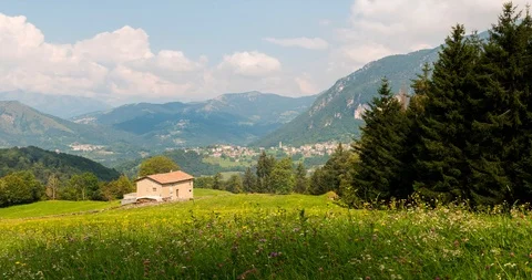 Sun and clouds shadow on an alpine panorama Stock Footage 115154929