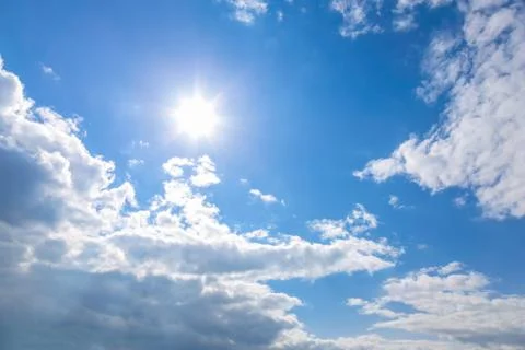 Sun and clouds on sky Stock Photos