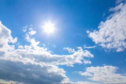 Sun and clouds on sky Stock Photos