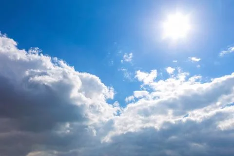 Sun and clouds on sky Stock Photos