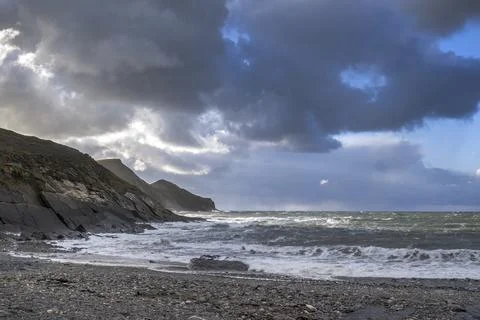 Sun and rain clouds at Crackington Haven beach Fotos Stock