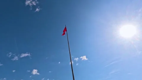 Sun and Red Flag Stock Footage 242971057