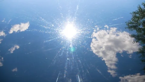 The sun and sky are reflected in the hood of the car Stock Footage 125131689