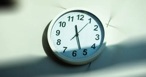 Sun and sky reflecting on clock face. Time lapse on a modern white Clock Video stock 166814382