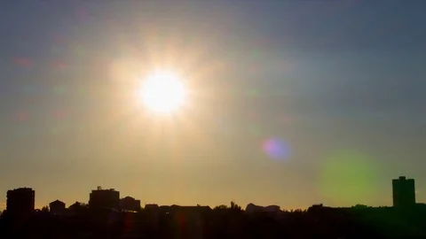 Sun and skyline at sunset with lense flares, timelapse, Stock Footage 81371757