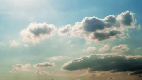 Sun and soft fluffy clouds on blue sky background. Time lapse Stock Footage 159751498