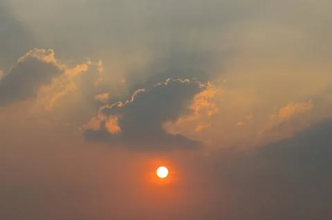 The Sun and Some Clouds at Sunset Stock Photos