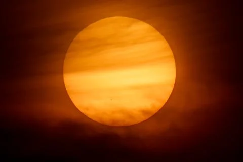 The sun and the sun set off behind the clouds Stock Photos