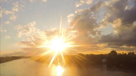 Sun and sunset over river and forest timelapse Video stock 79806816