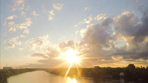 Sun and sunset over the river and forest timelapse Stock Footage 79808607