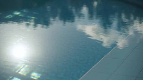Sun and tree reflections in turquoise blue water pool Video stock 114527814