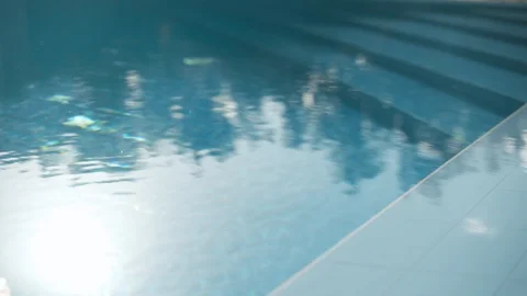 Sun and tree reflections in turquoise blue water pool Stock Footage 114528180