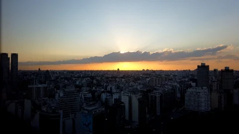 Sun appearing from behind clouds, at sunset Stock Footage