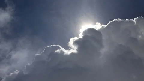 Sun appearing behind large clouds. Fast motion. Fog on first ground. Stock Footage 86694956