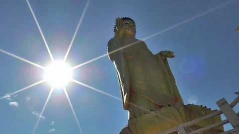 The sun aspires to the Buddha figure that blesses us, Ulaanbaatar, Mongolia. Stock Footage 304170375