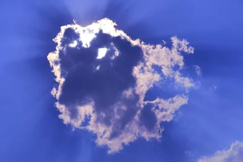 Sun babk on cloud and sunlight shine and passing on purple blue sky Stock Photos