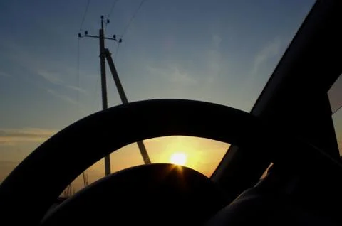 The sun in the background of the steering weel Fotos Stock